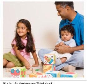 Father playing with his children